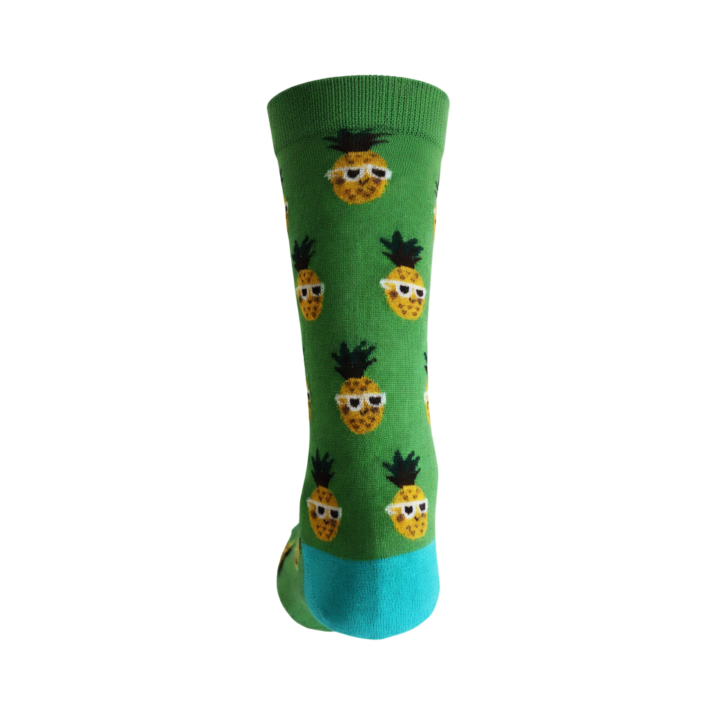 Green sock with pineapple pattern on a white background