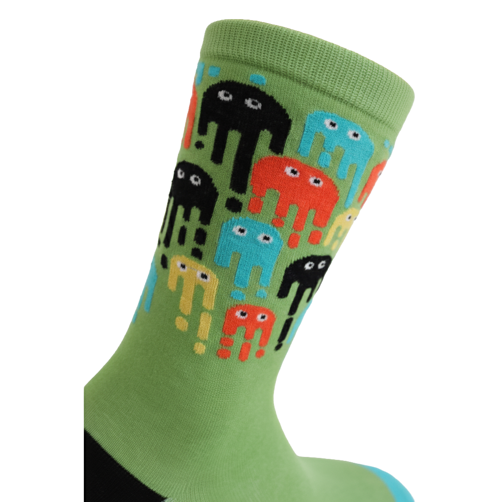 Green sock with colorful alien design on a white background