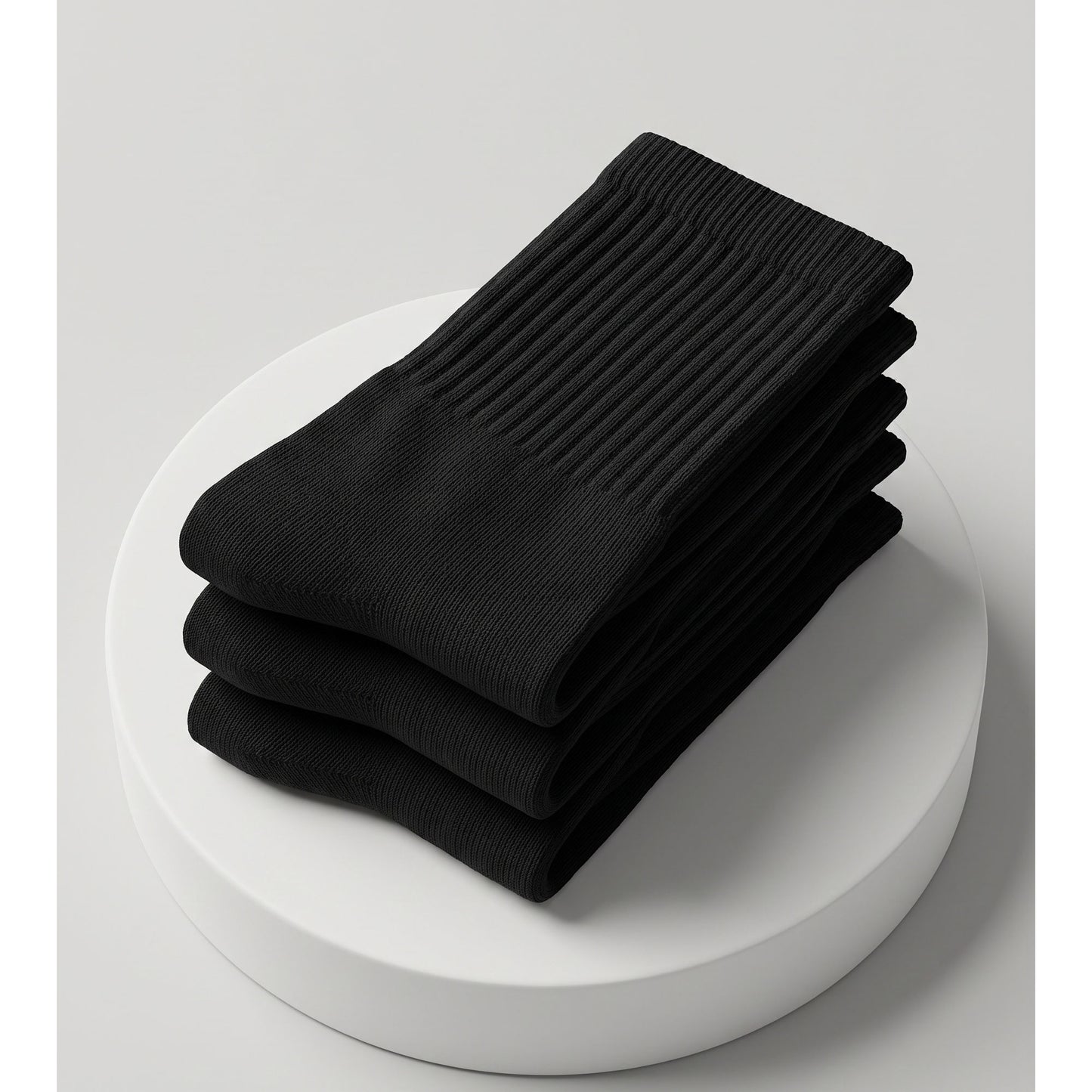 Three folded black cotton crew socks — triple pack
