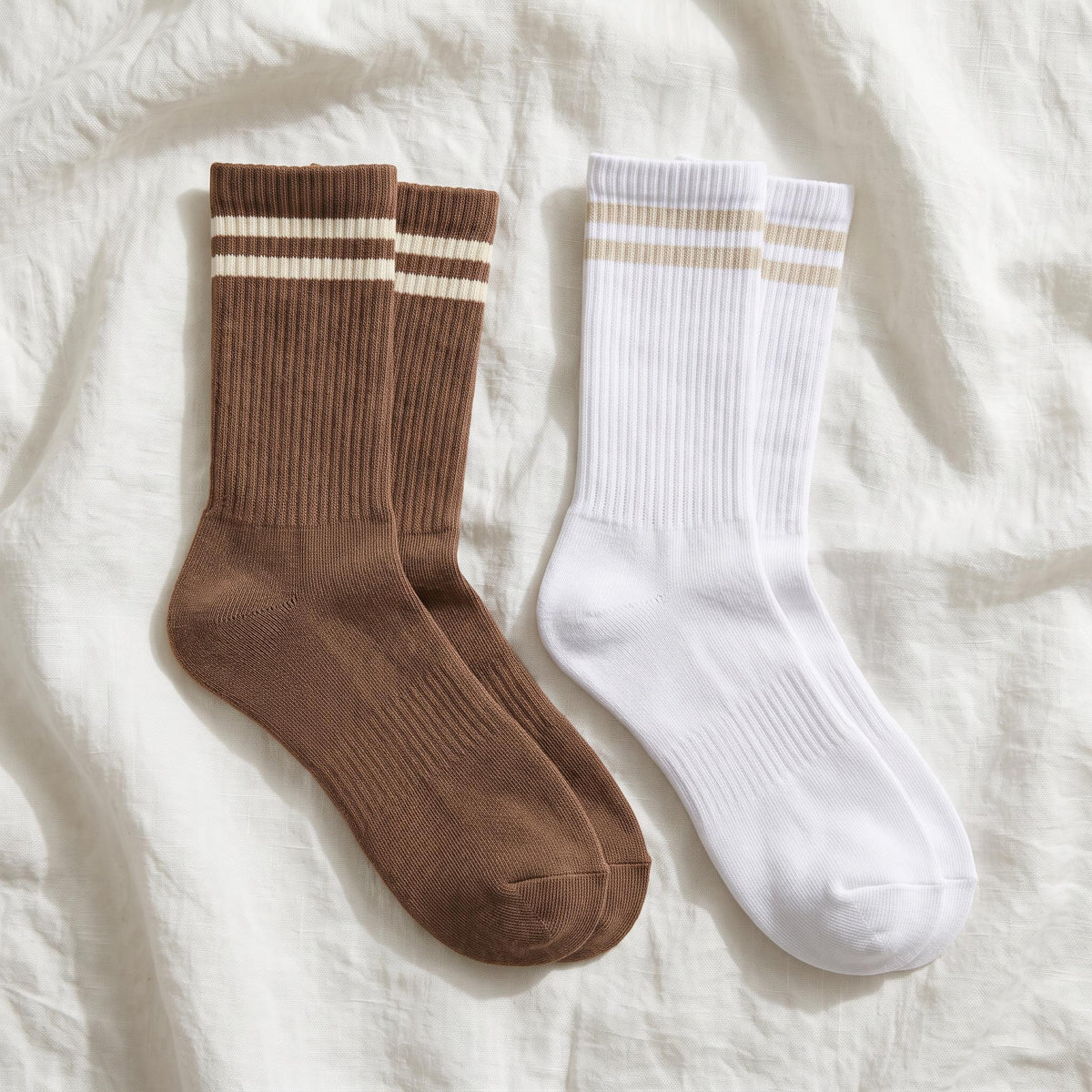 Louluu Women's cushioned tennis socks in brown with cream stripes and white with beige stripes — flat lay