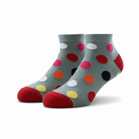 Colorful polka dot socks on a light gray background