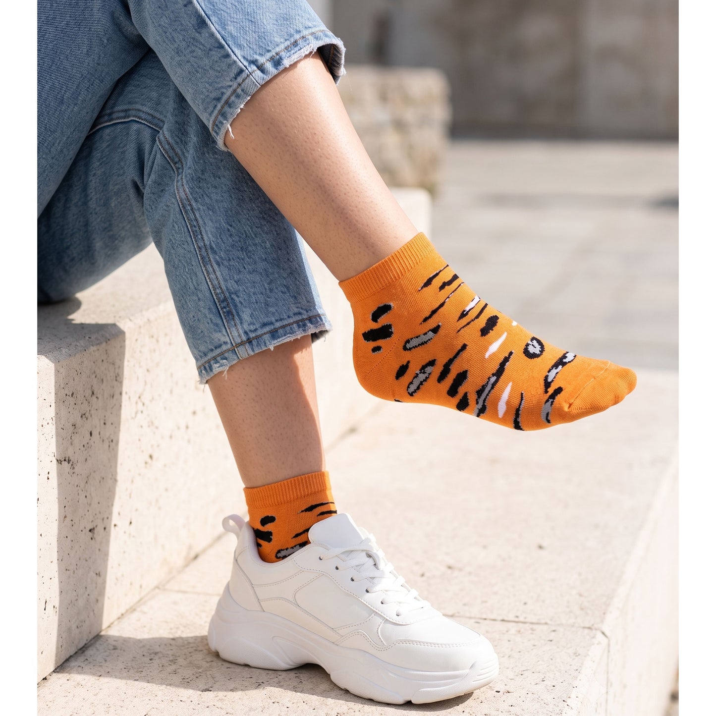 Orange leopard sneaker sock with stitched pattern — side view