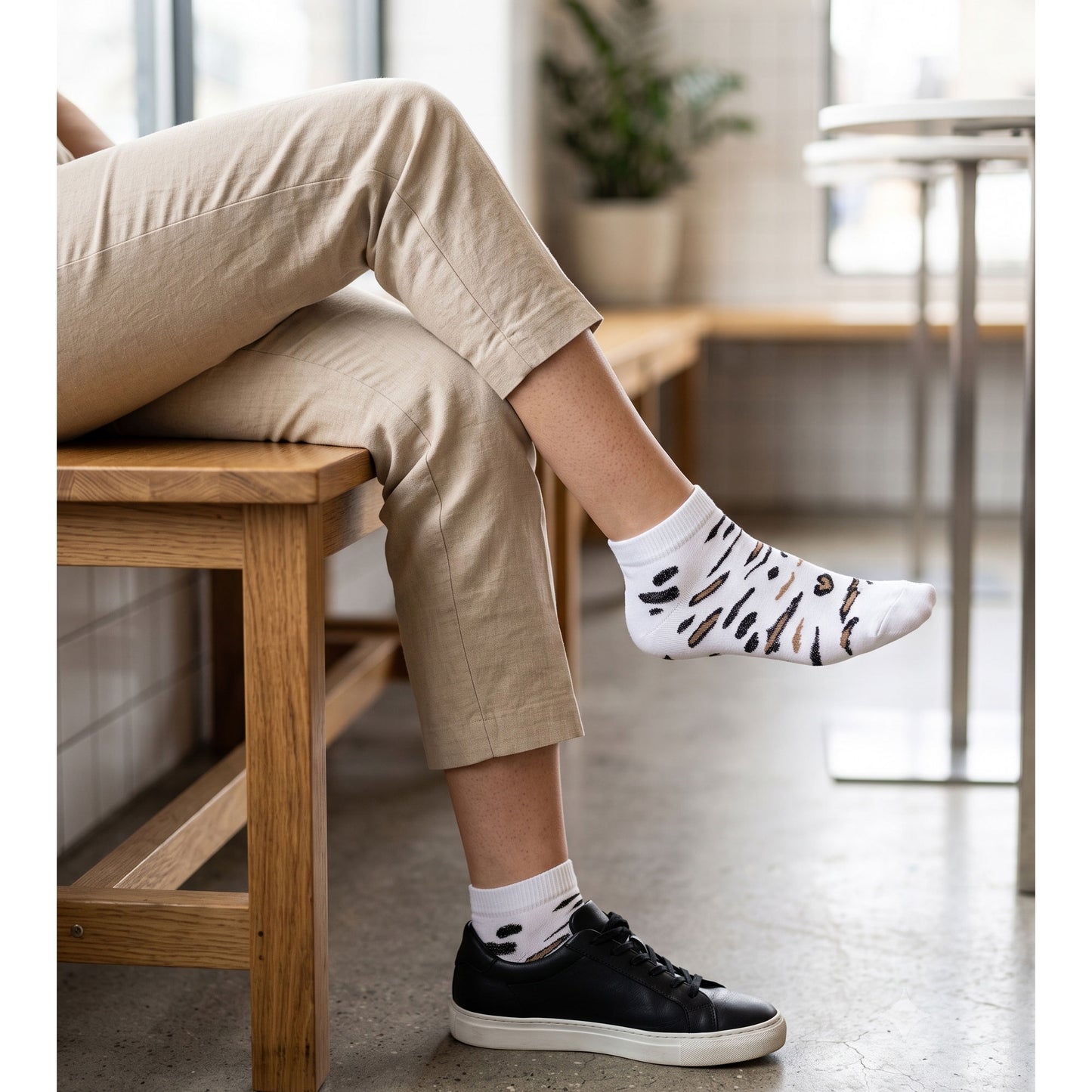 White leopard sneaker socks worn with black trainers