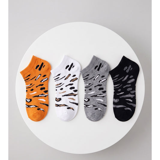 Louluu leopard sneaker socks 4-pack — orange, white, grey and black flat lay