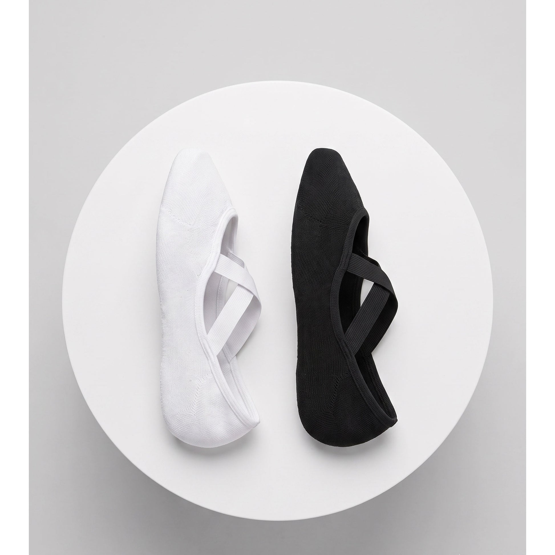 White and black ballet grip socks — top view