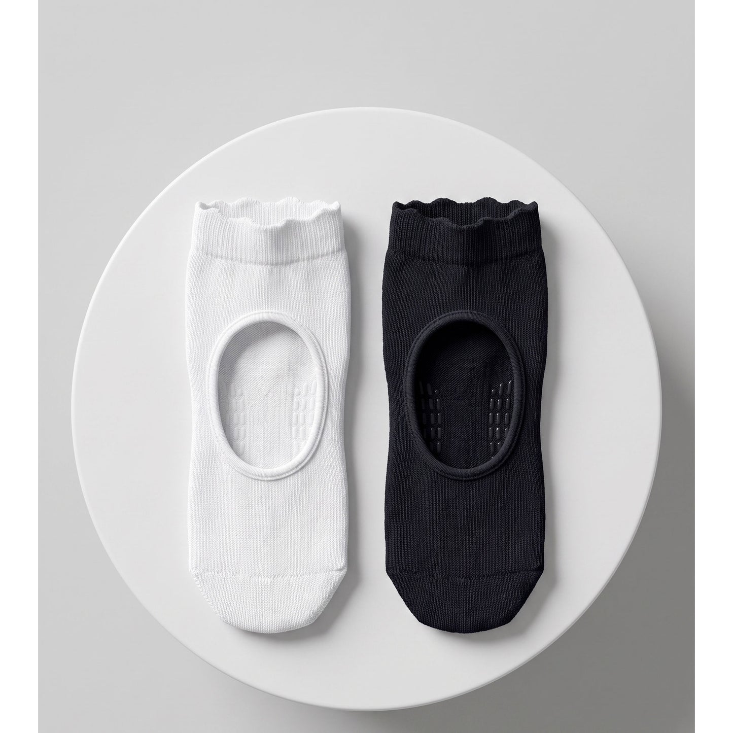 Louluu pilates grip socks trio — two black and one white
