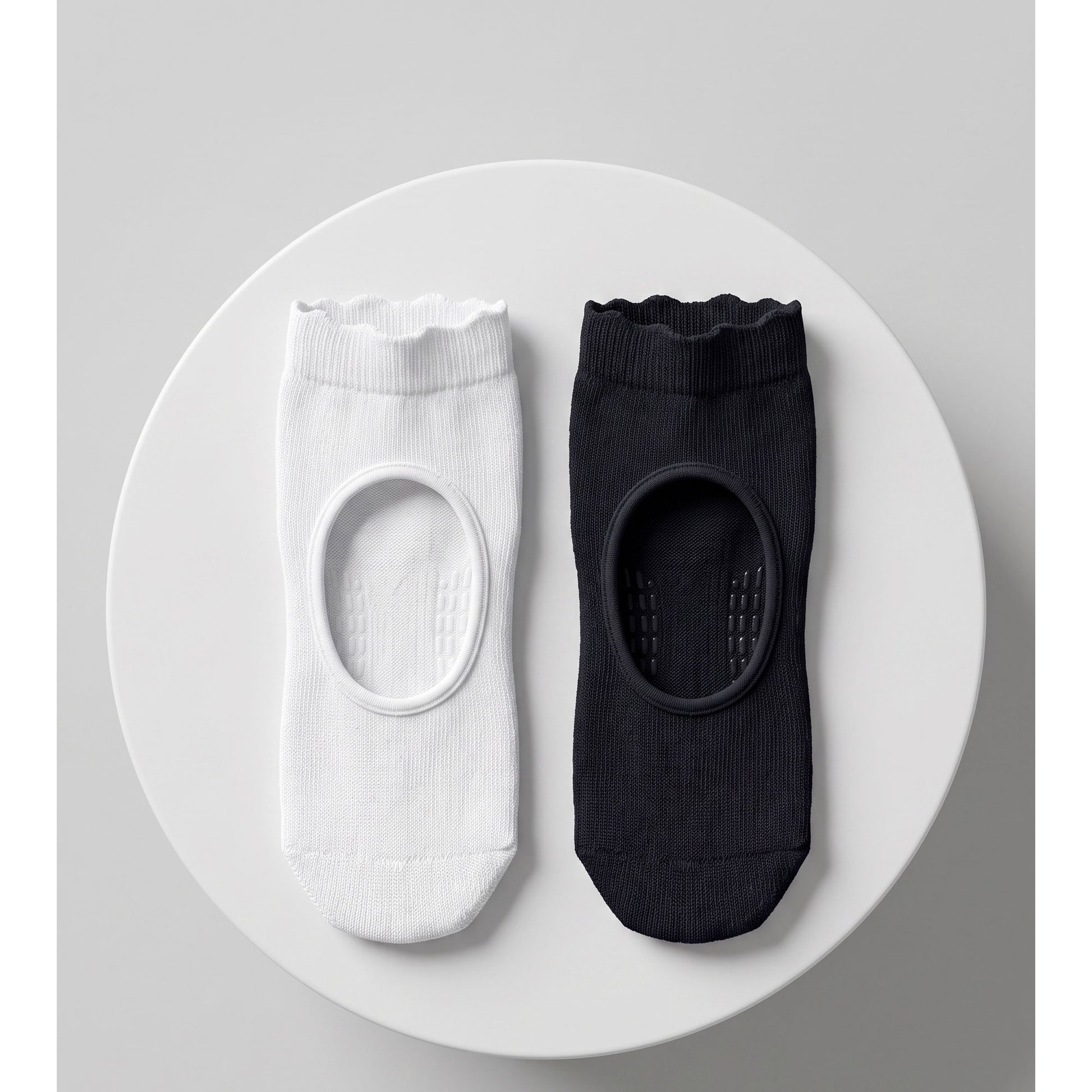 Louluu pilates grip socks trio — two black and one white