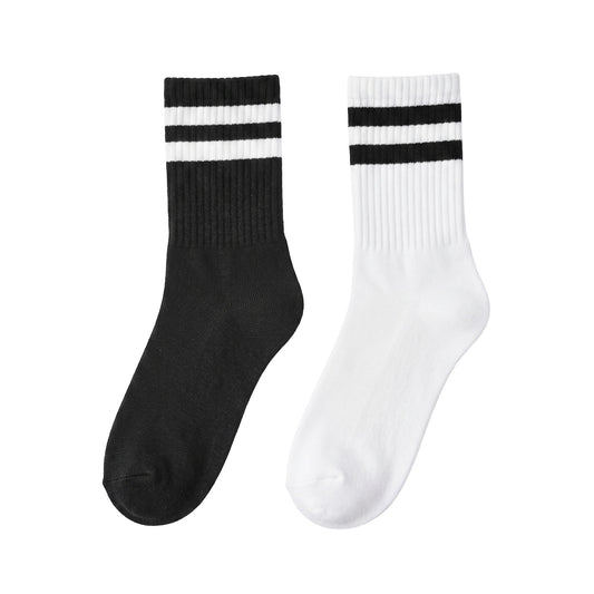 Half-crew socks pair — black with white stripes and white with black stripes