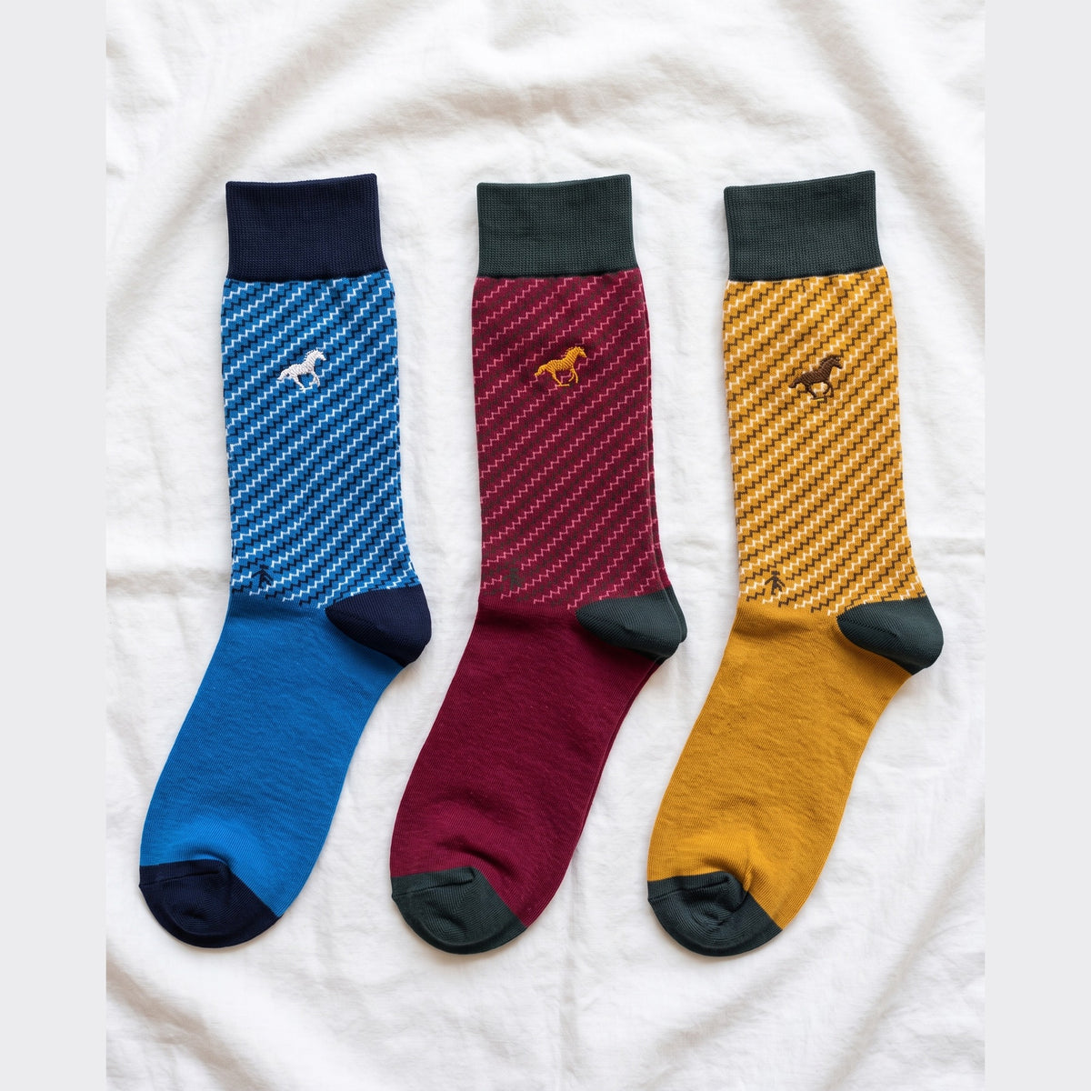 Louluu Galloper Zigzag crew socks in blue, burgundy and mustard with contrast cuffs — flat lay