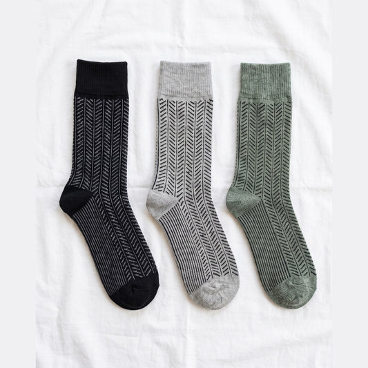 Louluu Herringbone lambswool crew socks in black, grey and khaki — flat lay