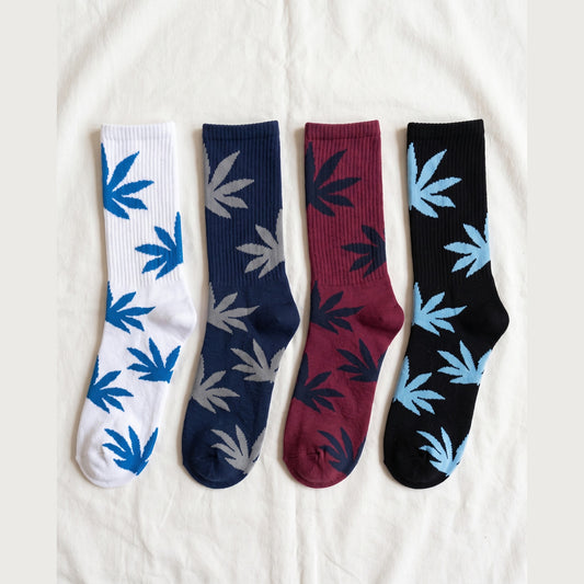 Louluu Leaf cushioned cotton crew socks in white, navy, burgundy and black with contrast leaf motifs — flat lay