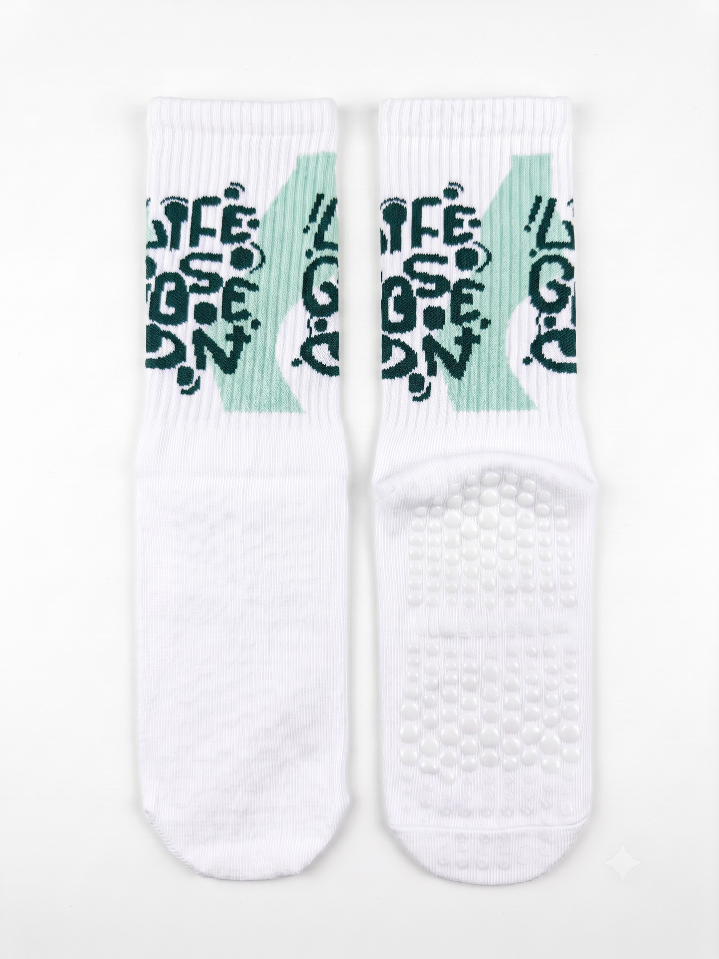 Life Goes On slogan grip socks — white ribbed crew with non-slip grip sole