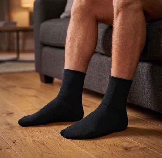 Louluu men's black bamboo diabetic ankle socks worn on feet — non-binding extra wide fit