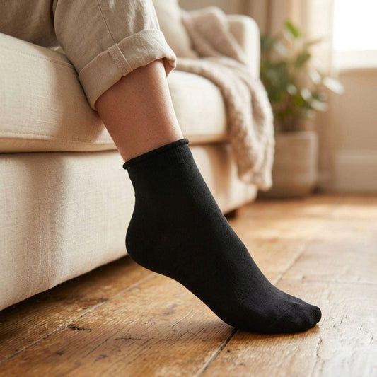 Louluu women's black bamboo diabetic ankle socks worn at home — soft non-binding ankle height for sensitive feet