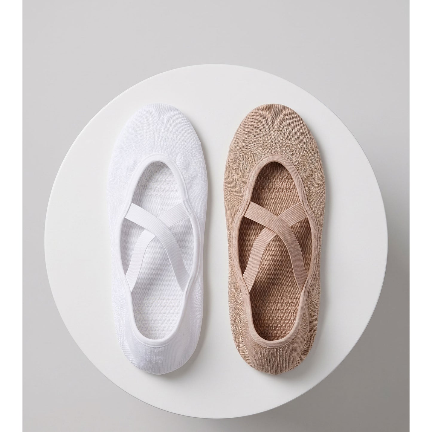 White and nude ballet grip socks — top view