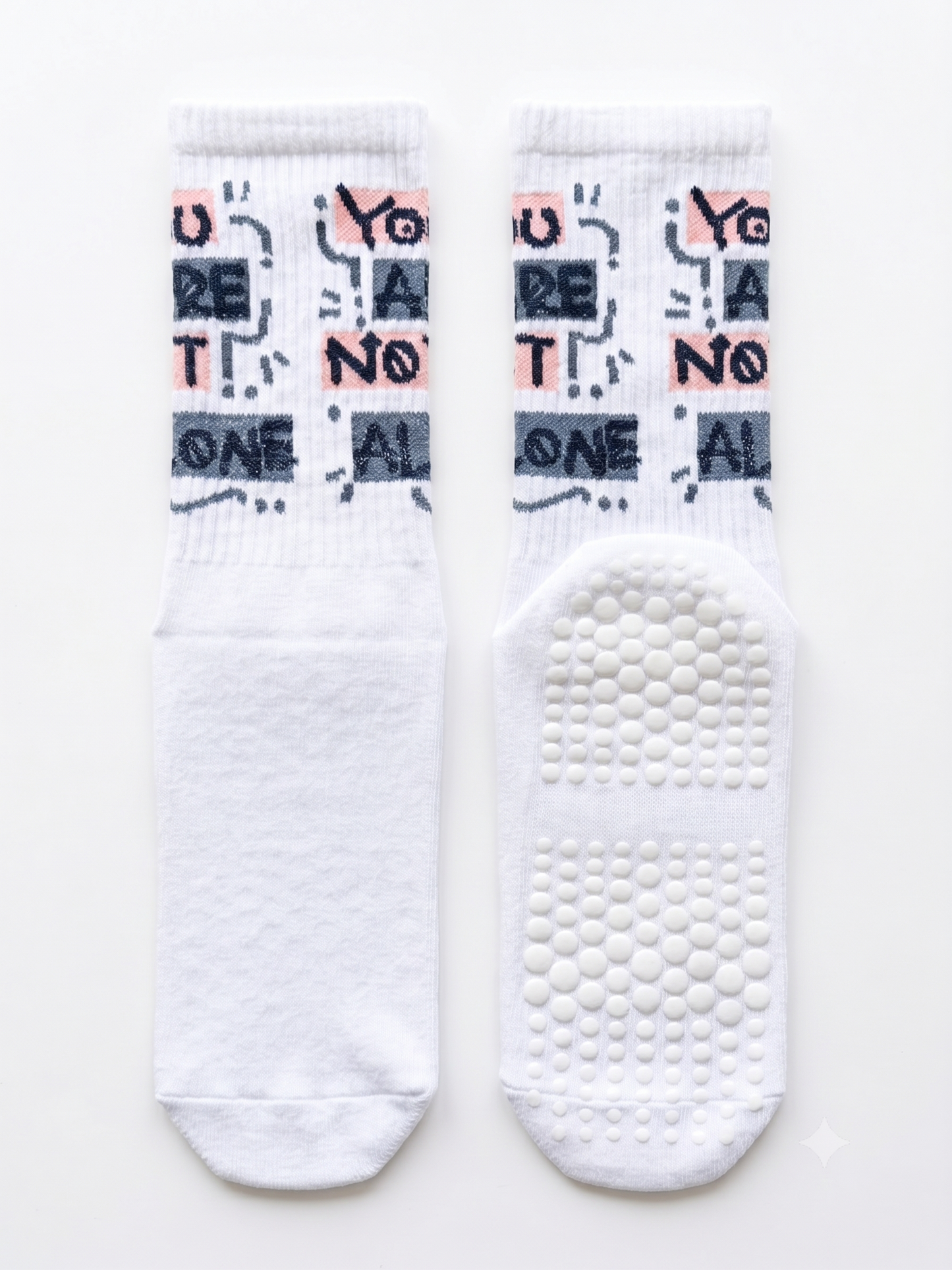 You Are Not Alone slogan grip socks — white ribbed crew with non-slip grip sole