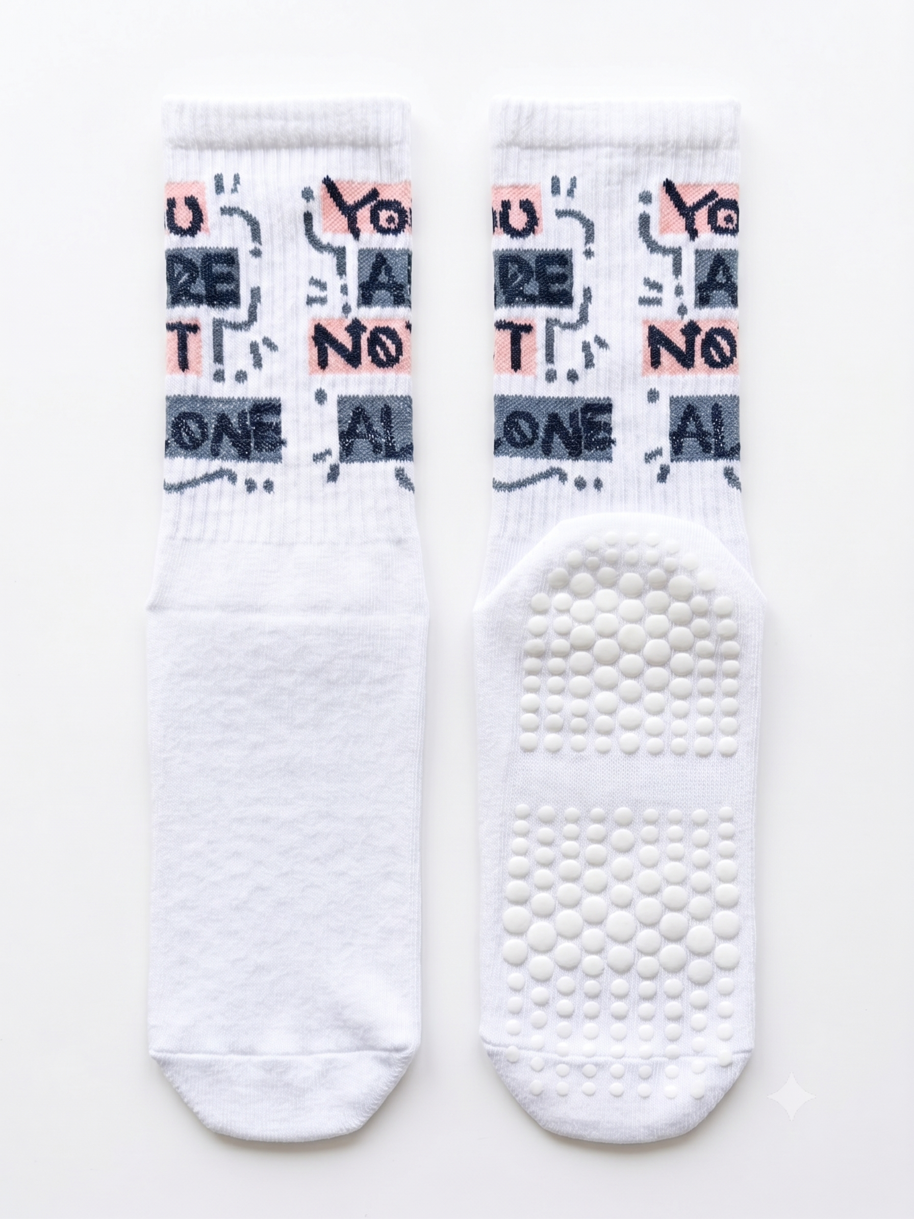 You Are Not Alone slogan grip socks — white ribbed crew with non-slip grip sole